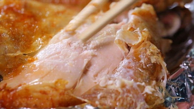 Chopsticks pulling tender chicken meat