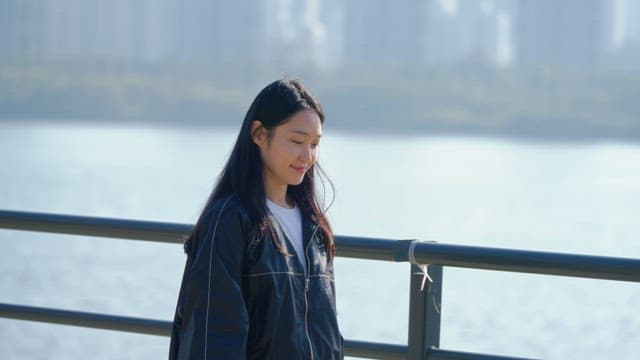 Woman drinking water while walking