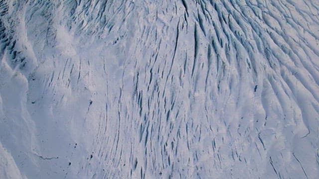 Vast glacier with snowy mountains
