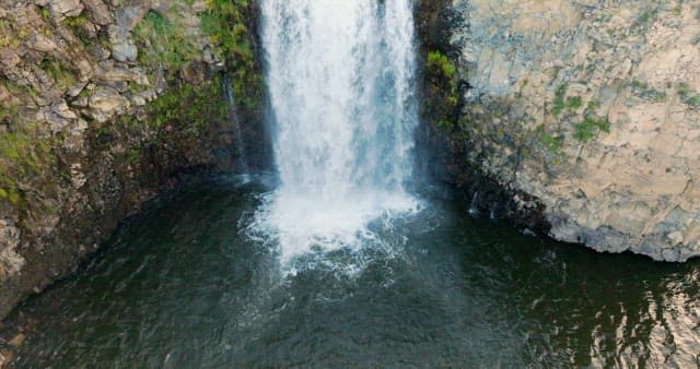 Scenic waterfall in a lush landscape