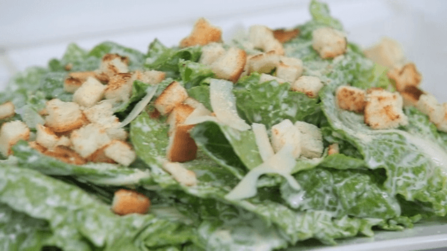 Fresh spring cabbage salad with croutons and cheese