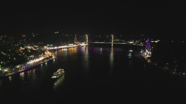 Night view of a brightly lit city and river
