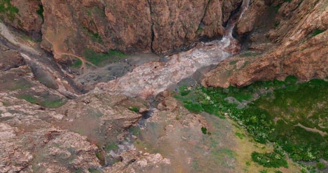 view of a rocky canyon with greenery