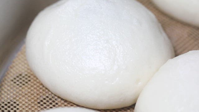 Fresh Steamed Buns on Woven Mat