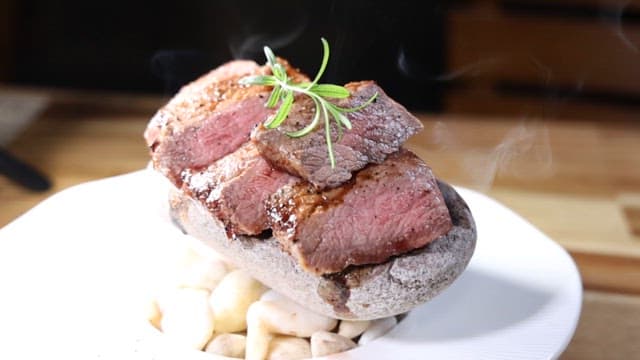 Premium Steak Plated with Stone on White Plate