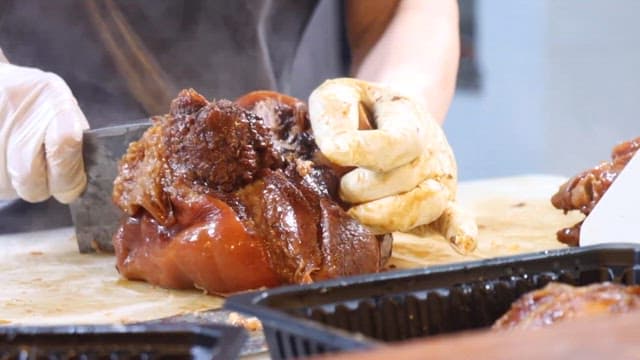 person who trims pig's feet