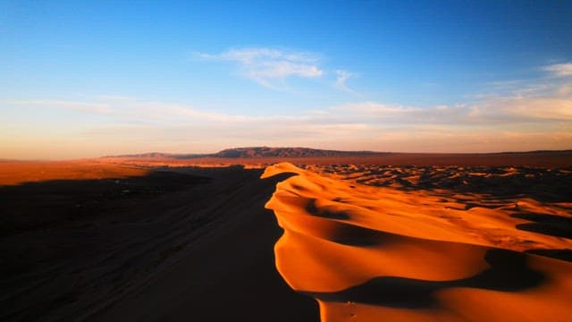 Sunset Over Vast Desert Dunes