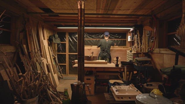 Man working in a cozy wooden workshop