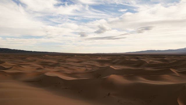 Vast desert landscape under a blue sky