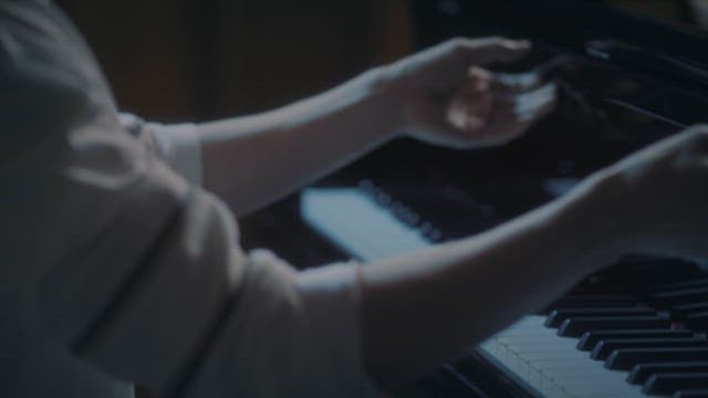 Hand Closing Piano Cover