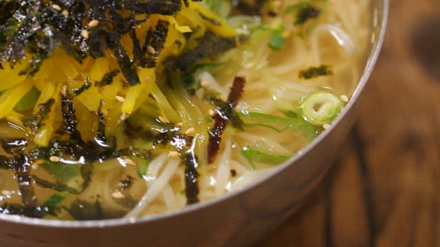 Appetizing cold udon served with toppings