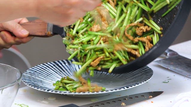 Freshly made chive and meat stir-fry plated on a plate