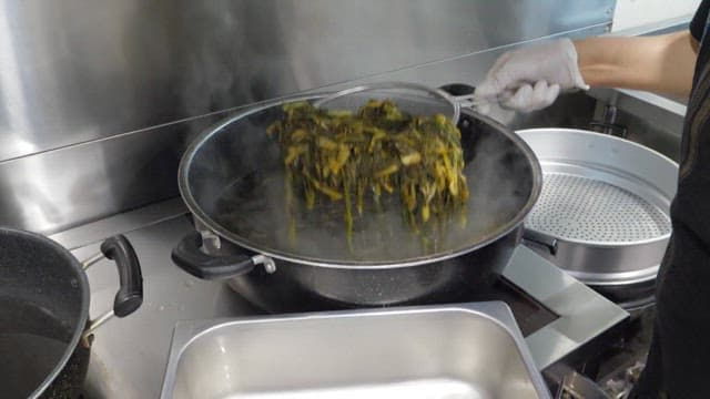 Person who takes out boiled dried radish greens