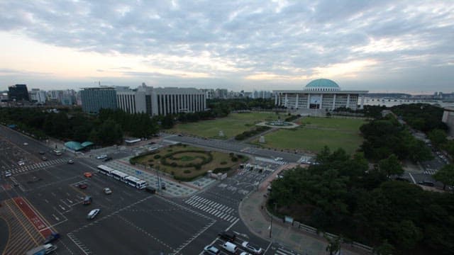 Dusk View of the National Assembly Building with Busy Traffic