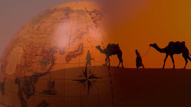 Caravan journey across desert dunes