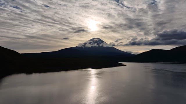 Mount Fuji silhouette with cloudy sky