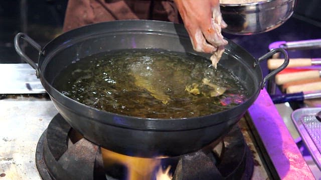 Battered pork in hot oil