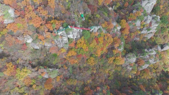 Colorful autumn mountain with rocky cliffs