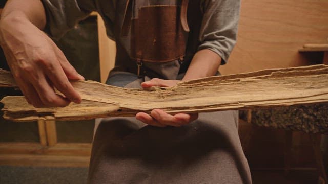 Craftsman working with wood indoors