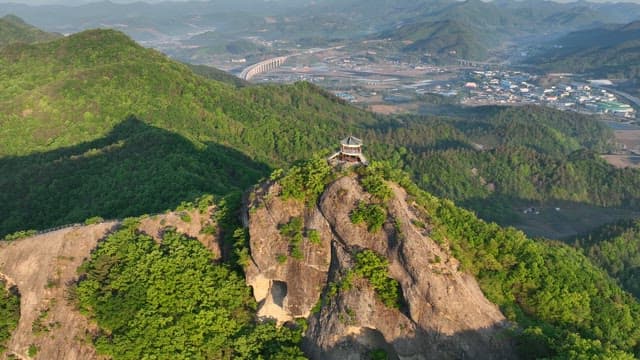 Pavilion on High-rise Green Mountain Peak at Dawn
