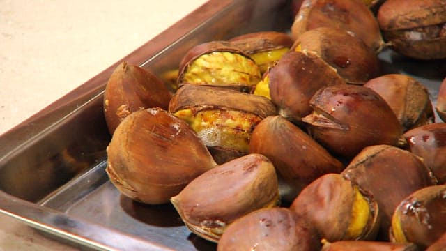 Roasted chestnuts on a tray