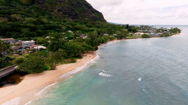 Aerial View of Coastal Village and Beach