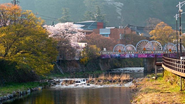 Scenic river with a colorful bridge
