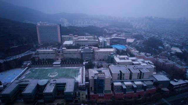 Overcast Day Over a Snowy Roof of University Campus