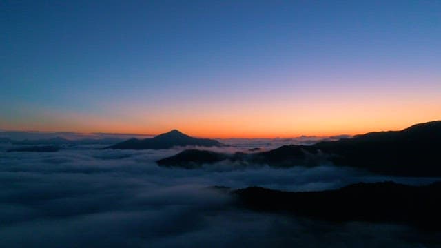 Sunrise Colors Beyond the Cloudy Mountain