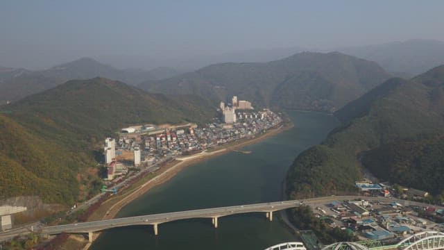 Scenic Skywalk Overlooking a Riverside Village
