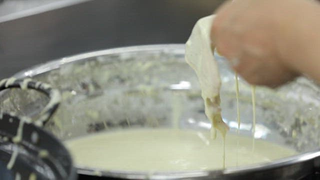 Putting the batter into hot oil