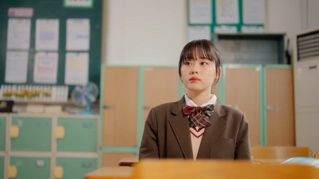 Student resting in a classroom
