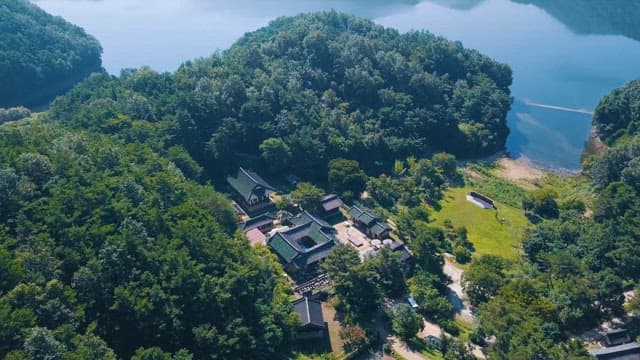 Traditional Village Amidst Lake and Mountains