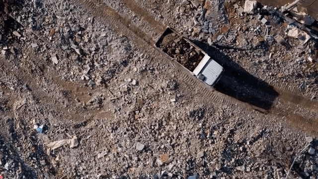 Truck moving through a construction site