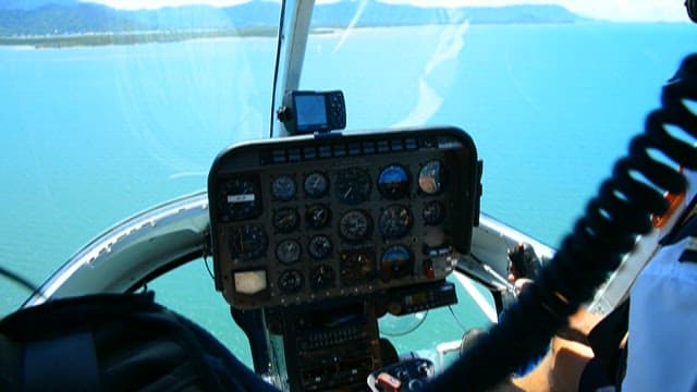 Helicopter Cockpit View Over Coastal Waters