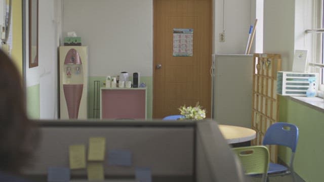 Female student shyly entering the school counseling room