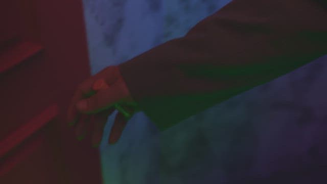 Person hesitating to open the door