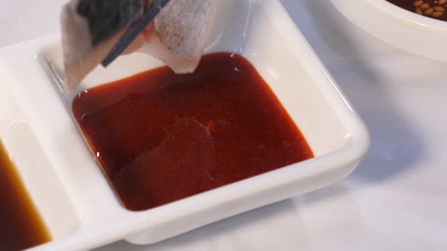 Mackerel sashimi marinated in red chili-pepper paste with vinegar