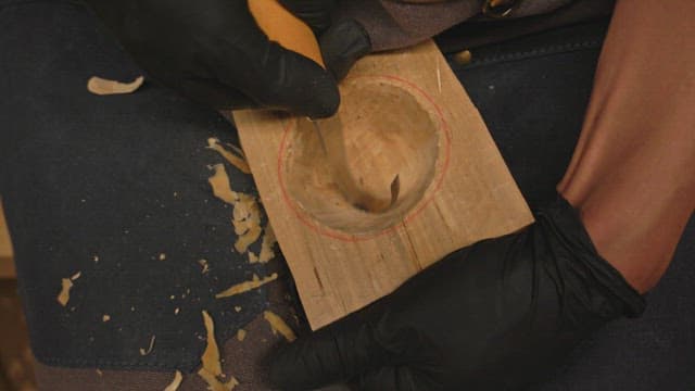Wood carving with a curved chisel