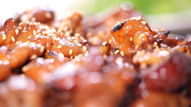 Grilled seasoned pork intestines with sesame seeds