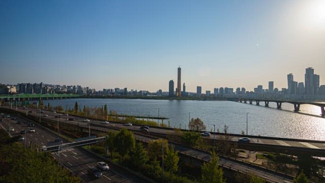 Time-lapse of Urban Traffic and Buildings from Day to Night