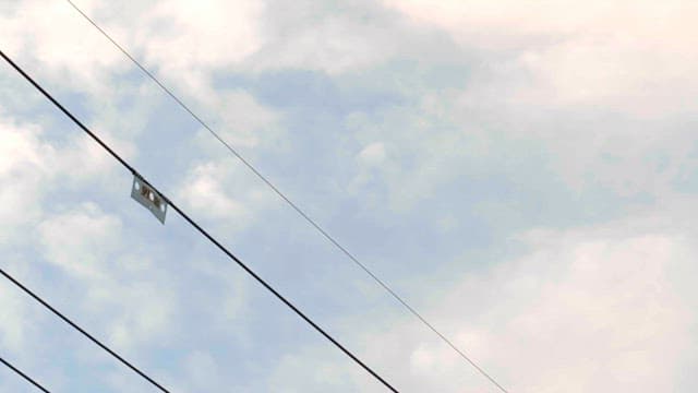 Power lines against a cloudy sky