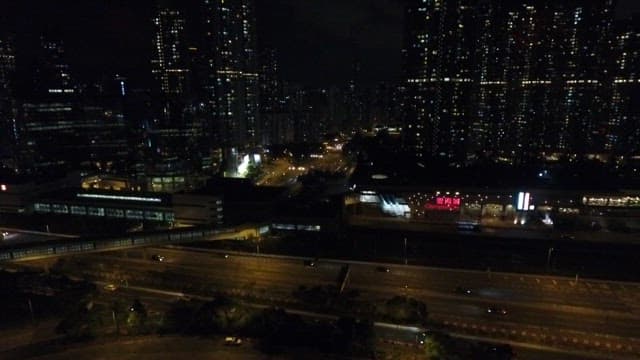 Aerial View of a Bustling Nighttime Cityscape