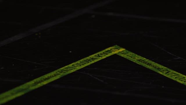 Yellow tape marking the photo line of a triangle