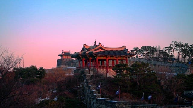 Traditional Korean fortress at sunset