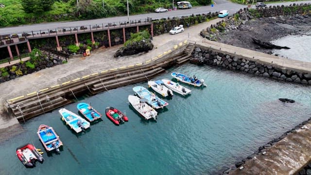 Small harbor and rocky coast with boats