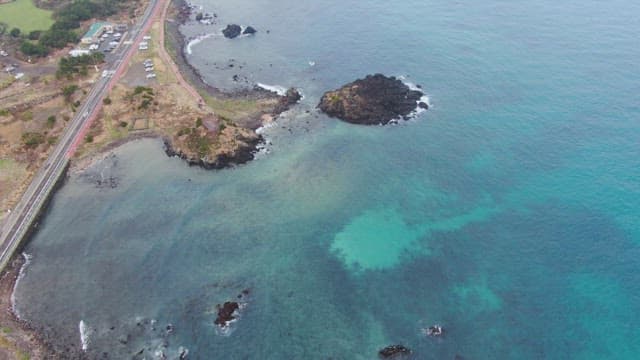Coastal road and rocky shoreline