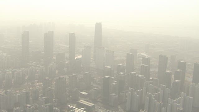 Urban Skyline in the Air Hazy with Fine Dust