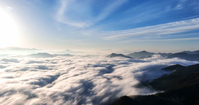 Mountains covered with clouds at sunrise