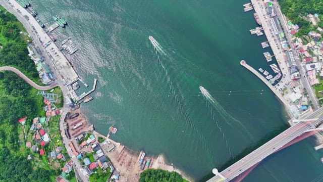 Boats sailing near a coastal